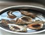 清水煮海螺的做法图解1